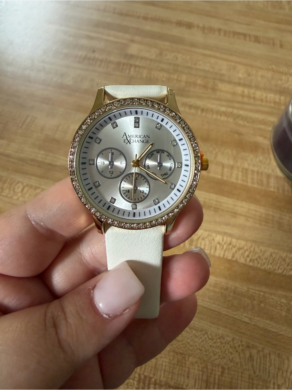 American Exchange Gold-Tone Watch with Cream Strap and Crystal Bezel